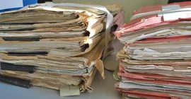 Mountains of files had to be studied for the project. Photo: MMZ.