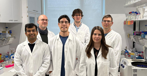 Team is presenting themselves in the laboratory