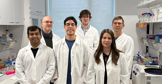 Team is presenting themselves in the laboratory