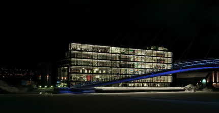 University building and bridge in the night