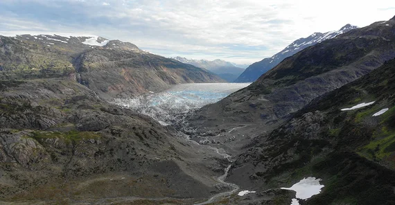 Salmon Glacier (British Columbia, Canada) dams Summit Lake, which has broken out at least once a year since the 1960s. This drone image from 9/21/2022 shows the lake empty, with the last icebergs on the lake bottom. In recent decades, the lake's extent has steadily decreased. As recently as the 1990s, the lake also filled the front left section of the image.