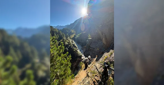 A person climbing at a mountain cliff.